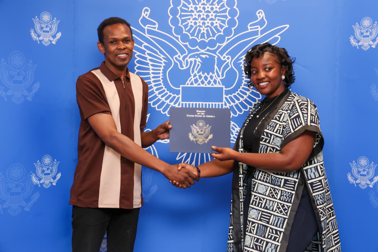 Teddy Jeremy receiving a certificate at the U.S. Embassy in Nairobi